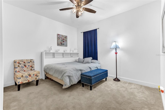 bedroom with baseboards, carpet, and a ceiling fan