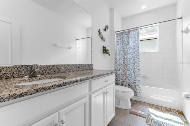 bathroom with vanity, tile patterned floors, shower / tub combo, and toilet