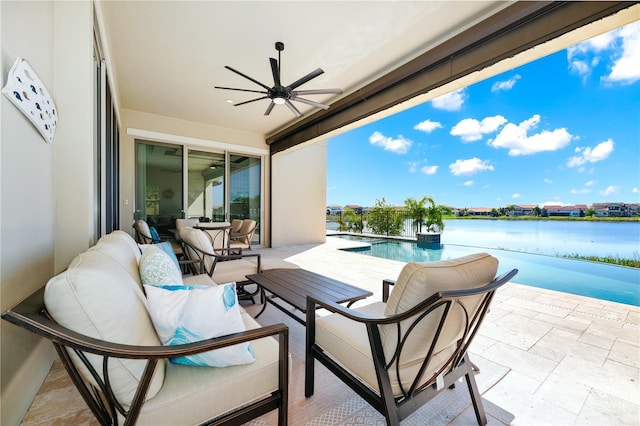 view of patio featuring an outdoor hangout area, a water view, a ceiling fan, and an outdoor pool