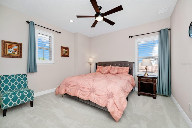 bedroom with light carpet, ceiling fan, baseboards, and recessed lighting