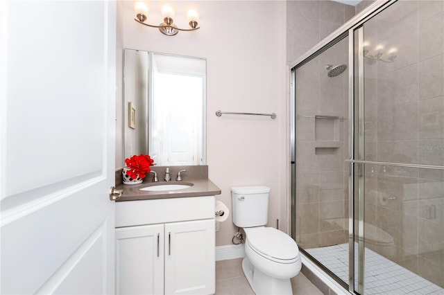 full bathroom featuring toilet, a stall shower, tile patterned floors, and vanity