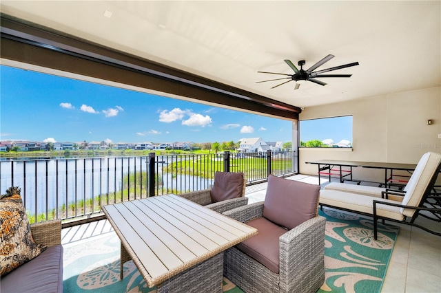 view of patio / terrace with ceiling fan, outdoor lounge area, a water view, and a balcony