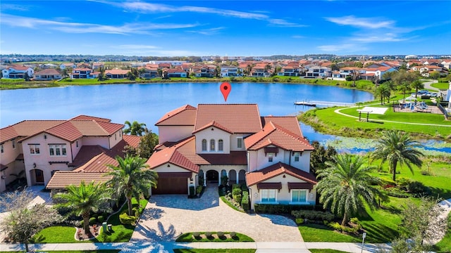 bird's eye view featuring a water view and a residential view