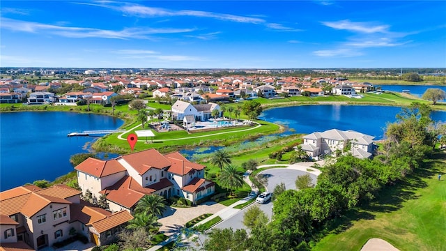 bird's eye view with a water view and a residential view