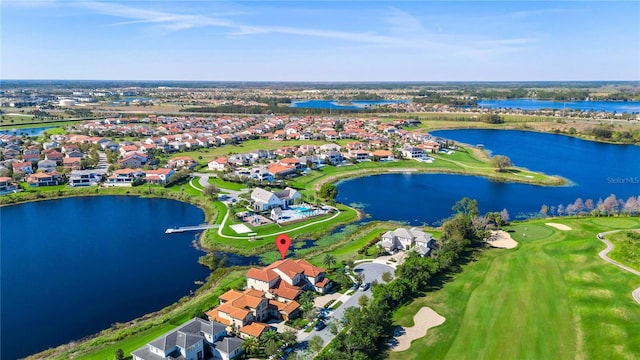 aerial view featuring view of golf course, a water view, and a residential view