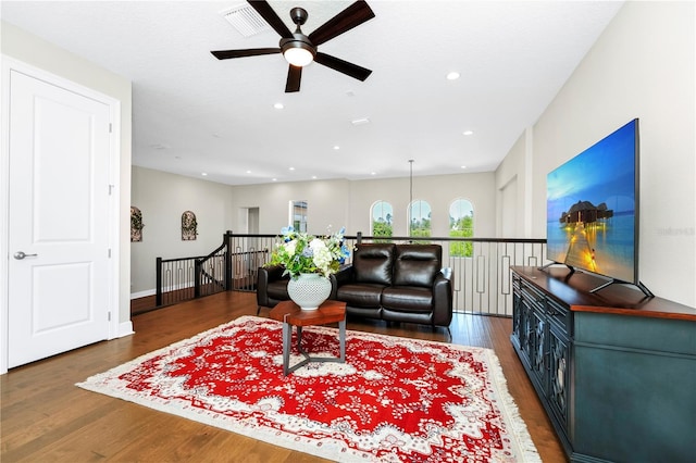 living room featuring wood finished floors, visible vents, and recessed lighting