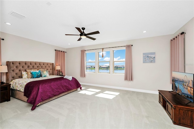 bedroom featuring baseboards, recessed lighting, visible vents, and light colored carpet