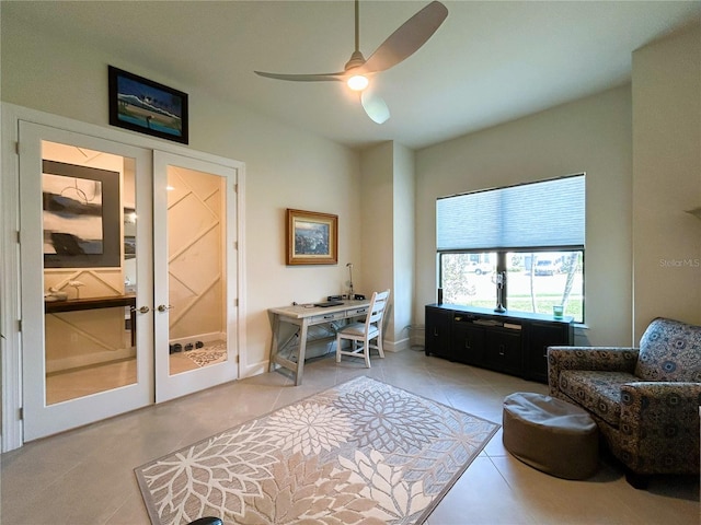 office featuring light tile patterned floors, ceiling fan, and french doors