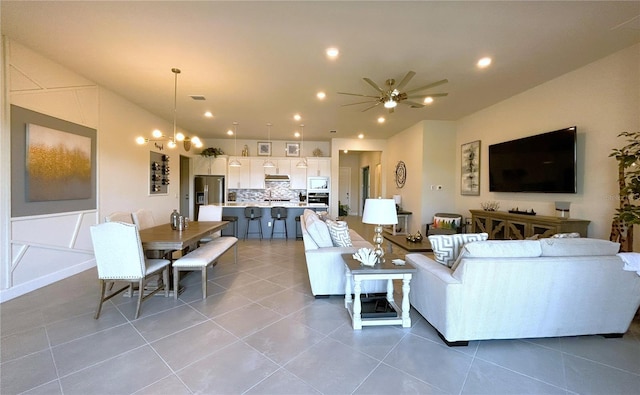 living room featuring light tile patterned flooring, visible vents, and recessed lighting