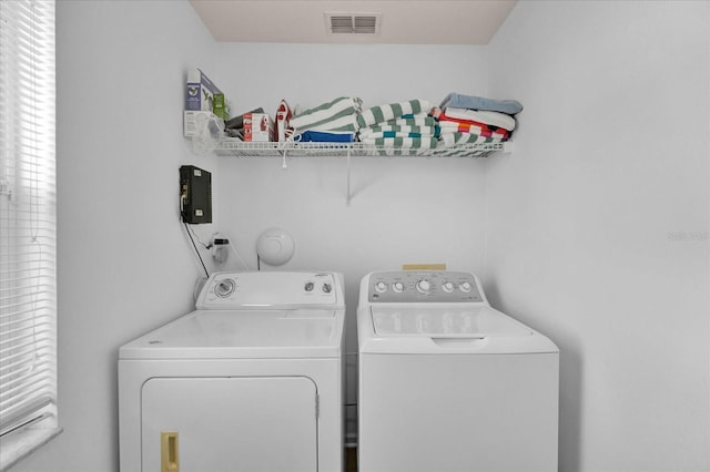 laundry room featuring laundry area, washer and clothes dryer, and visible vents