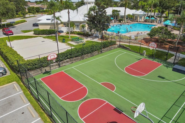 view of basketball court with community basketball court and fence