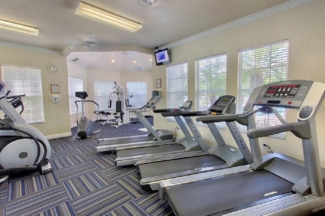 workout area featuring carpet, baseboards, and ornamental molding