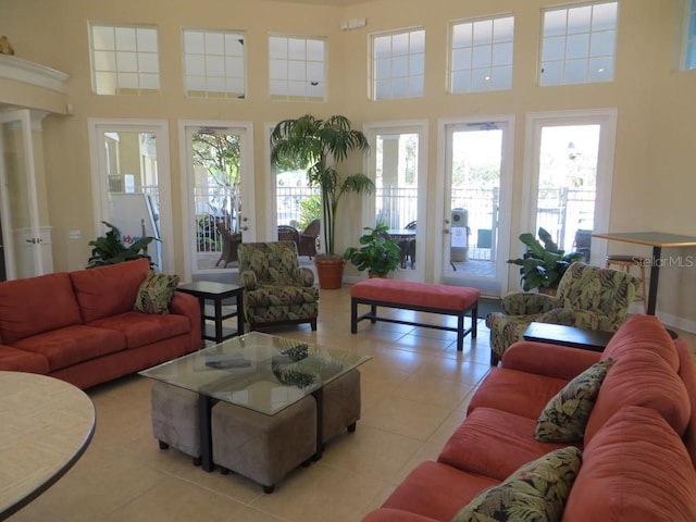 interior space with a high ceiling and plenty of natural light