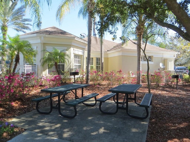 view of property's community with a patio area