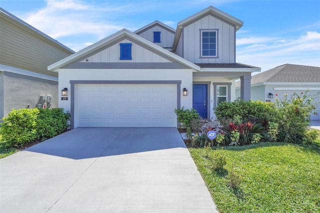 view of front of home with board and batten siding, concrete driveway, and an attached garage