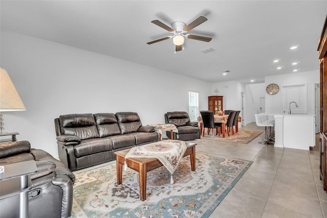 living area featuring a ceiling fan, recessed lighting, visible vents, and light tile patterned floors