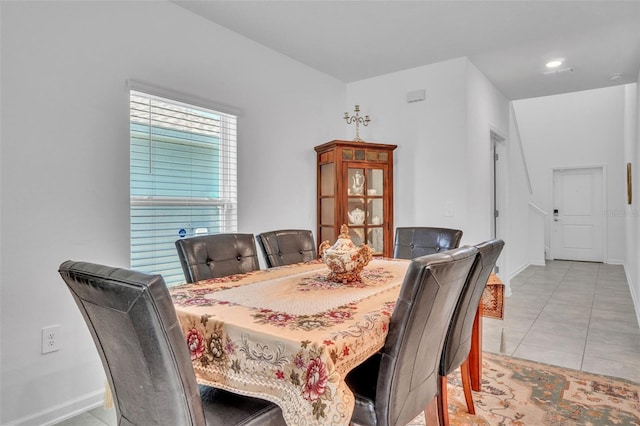 dining room with light tile patterned floors and baseboards