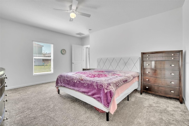 bedroom featuring carpet floors, visible vents, baseboards, and a ceiling fan