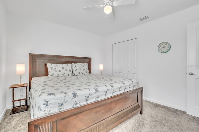 bedroom featuring carpet floors, a closet, visible vents, and baseboards