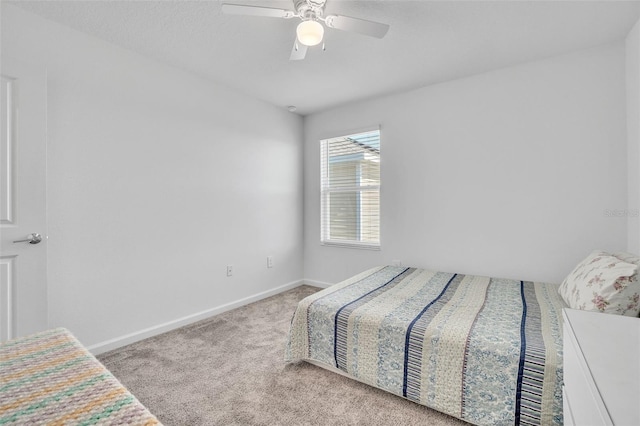 bedroom with carpet, baseboards, and ceiling fan