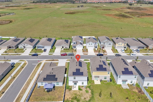 birds eye view of property with a residential view