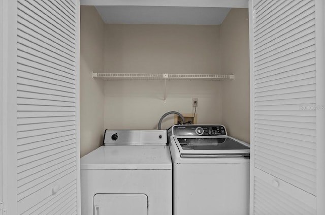 laundry room featuring laundry area and washer and clothes dryer