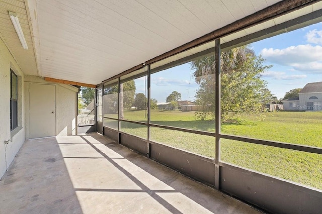 unfurnished sunroom with plenty of natural light