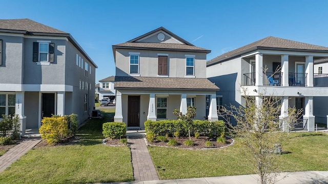 view of front of home with stucco siding, a porch, cooling unit, and a front yard