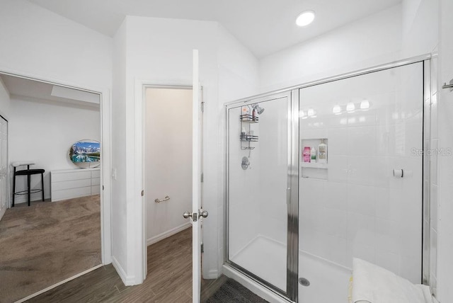 full bath featuring a stall shower, wood finished floors, and recessed lighting