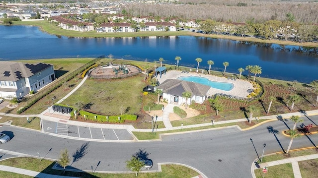 drone / aerial view featuring a water view and a residential view