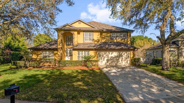 view of front of house featuring a front yard, an attached garage, driveway, and stucco siding