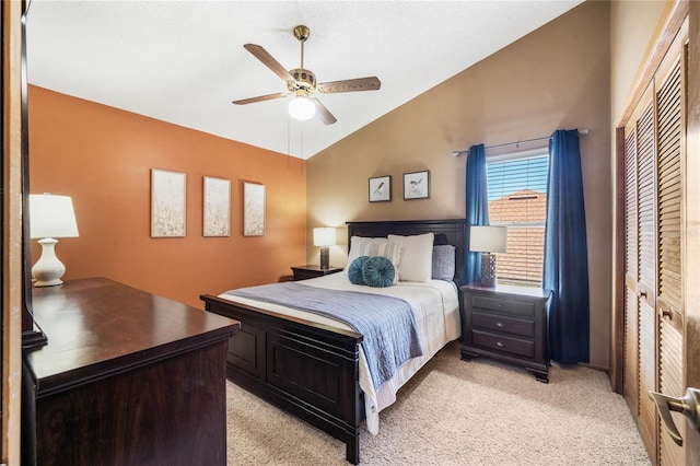 bedroom with light colored carpet, a ceiling fan, and lofted ceiling