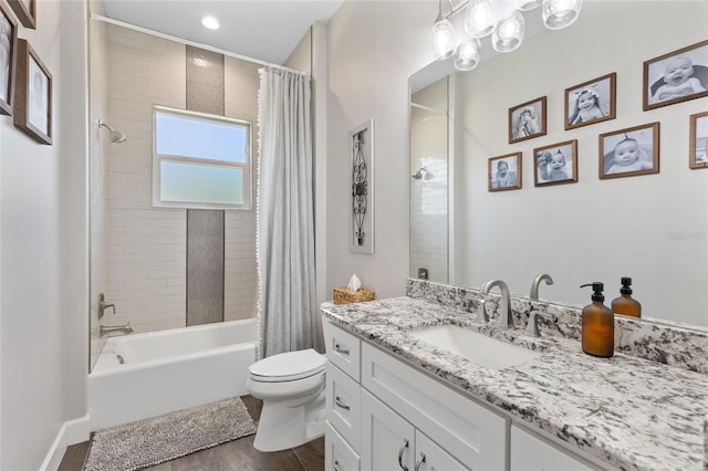 bathroom with shower / bath combination with curtain, vanity, toilet, and wood finished floors