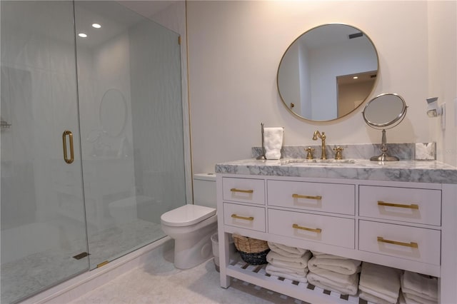 bathroom featuring recessed lighting, a stall shower, toilet, and vanity