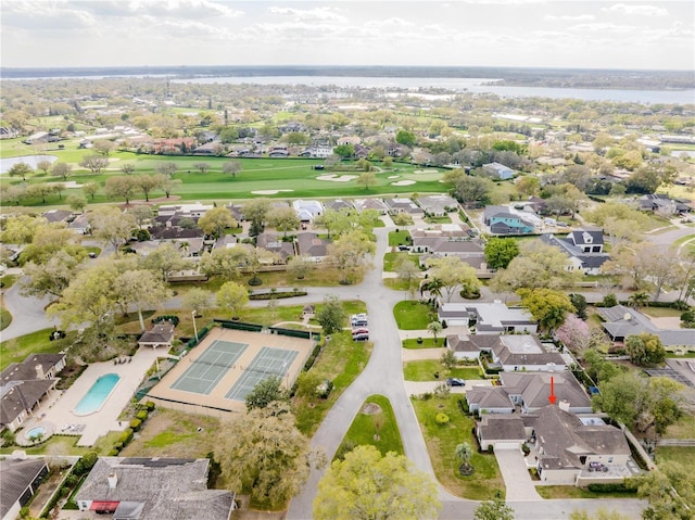 birds eye view of property featuring view of golf course and a residential view