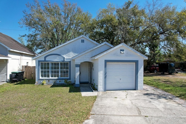 single story home featuring an attached garage, fence, a front lawn, and concrete driveway