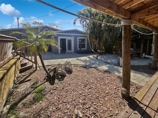 exterior space with a patio and fence