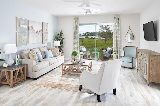 living area with light wood-type flooring and a ceiling fan