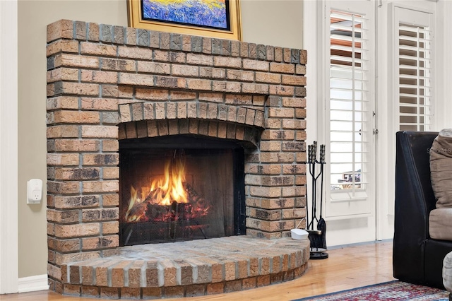 interior details with a fireplace and wood finished floors