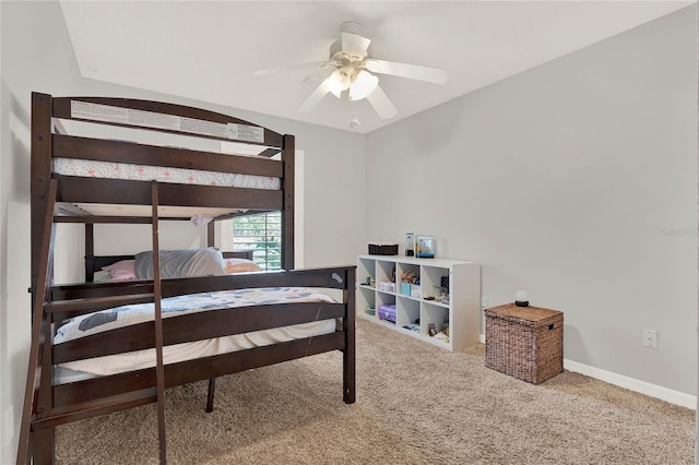 bedroom featuring a ceiling fan, carpet, and baseboards