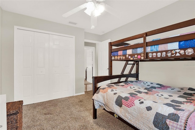 bedroom with visible vents, carpet, a closet, and ceiling fan