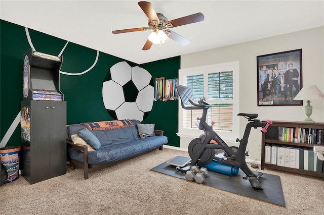 workout area with ceiling fan, baseboards, and carpet