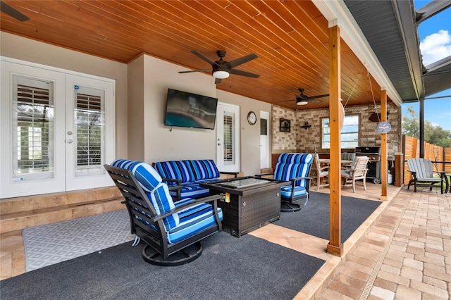 view of patio featuring an outdoor living space, french doors, and ceiling fan