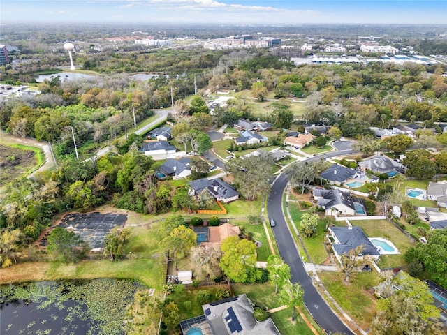 birds eye view of property with a residential view and a water view