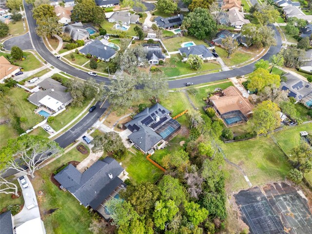 birds eye view of property with a residential view