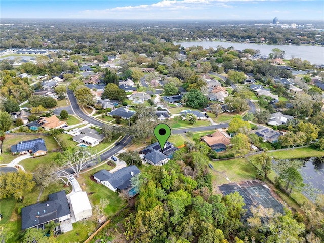 bird's eye view featuring a water view and a residential view