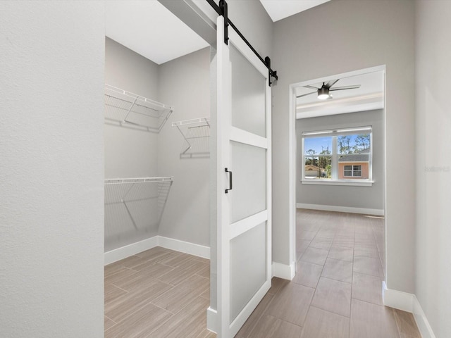 24520 Kingsway Cir, Punta Gorda, FL 33983 - spacious closet featuring wood finish floors and a barn door