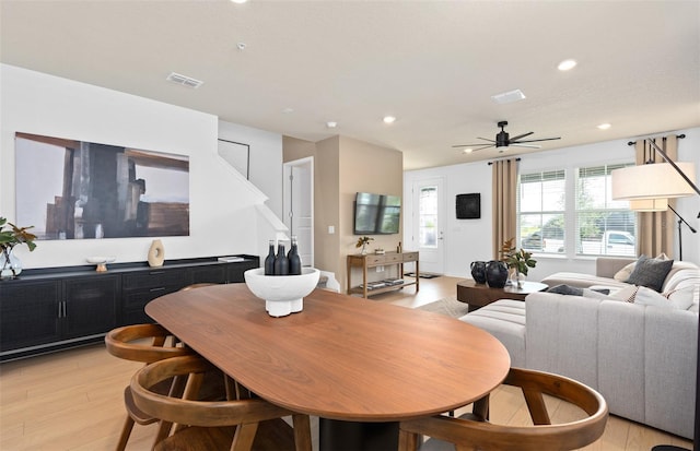 dining room with ceiling fan, recessed lighting, visible vents, and light wood-style floors