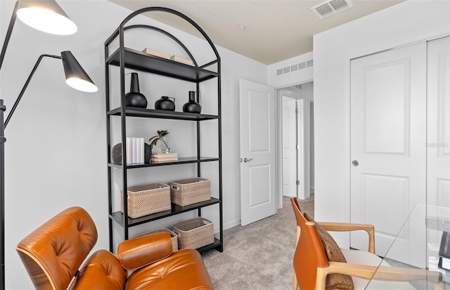 office area featuring visible vents and light colored carpet