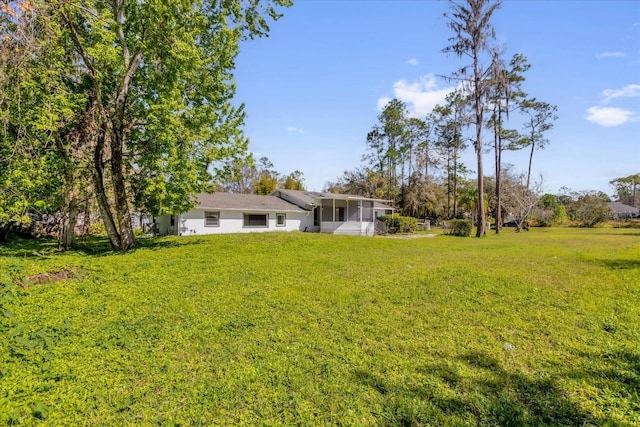 view of yard with a sunroom